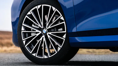 BMW 223i Active Tourer - front N/S wheel