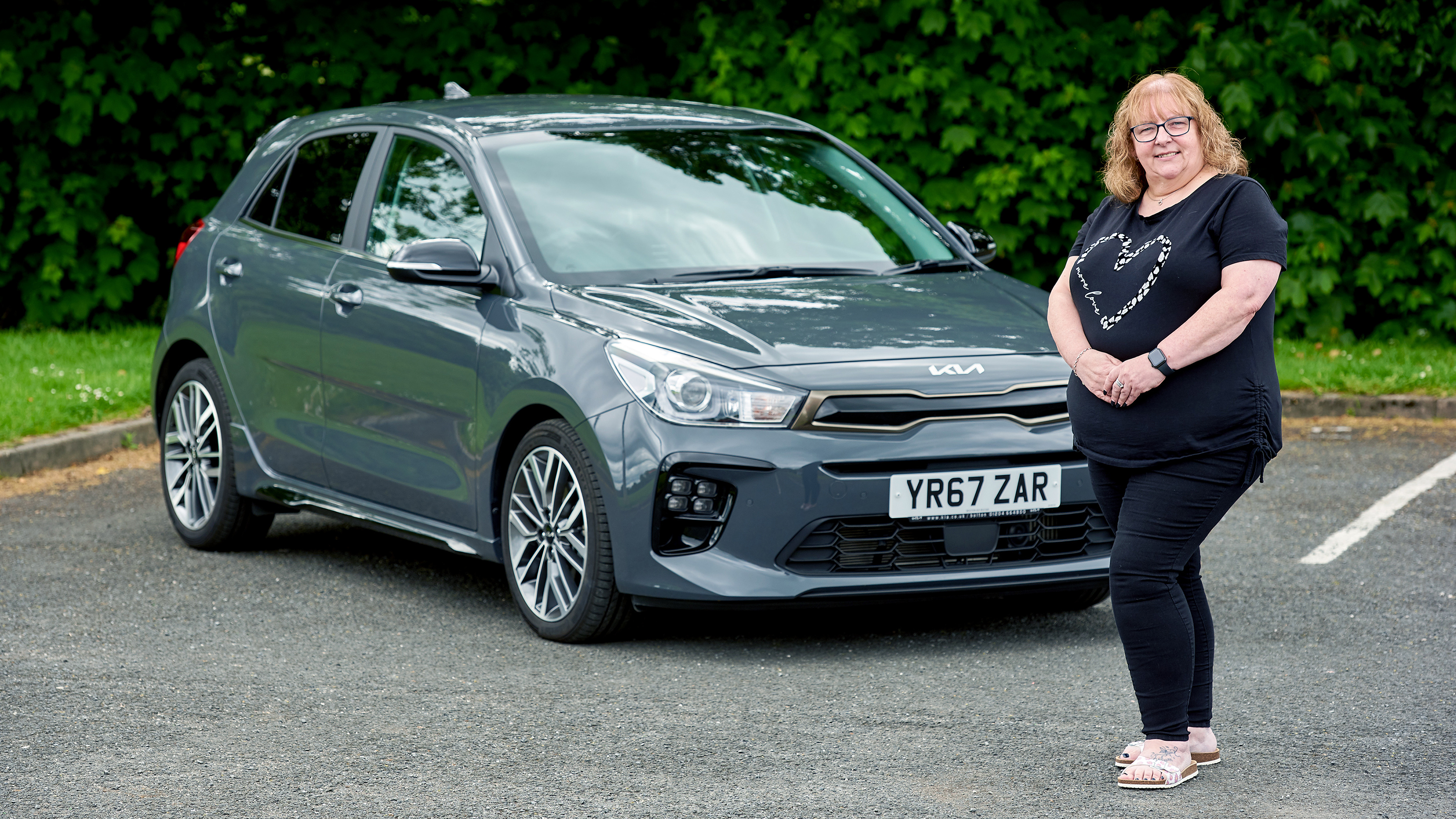 Owner Zoe Rogers with their Kia Rio