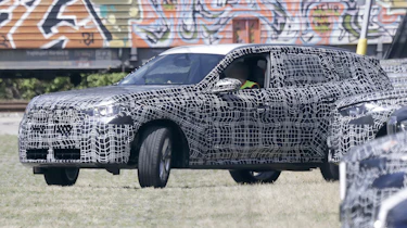 2024 BMW X3 spyshot - side (reversing into bay)