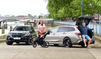 BMW 330e and iX3 on riverbank 1