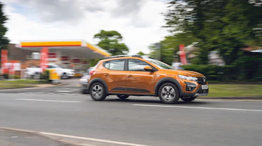 Dacia Sandero Stepway passing a petrol station