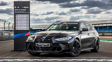 BMW M3 Touring - parked by scoreboard