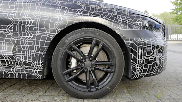 2023 BMW 5 Series (camouflaged) - front o/s wheel
