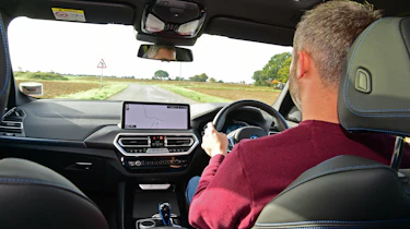 BMW iX3 - over-shoulder driving