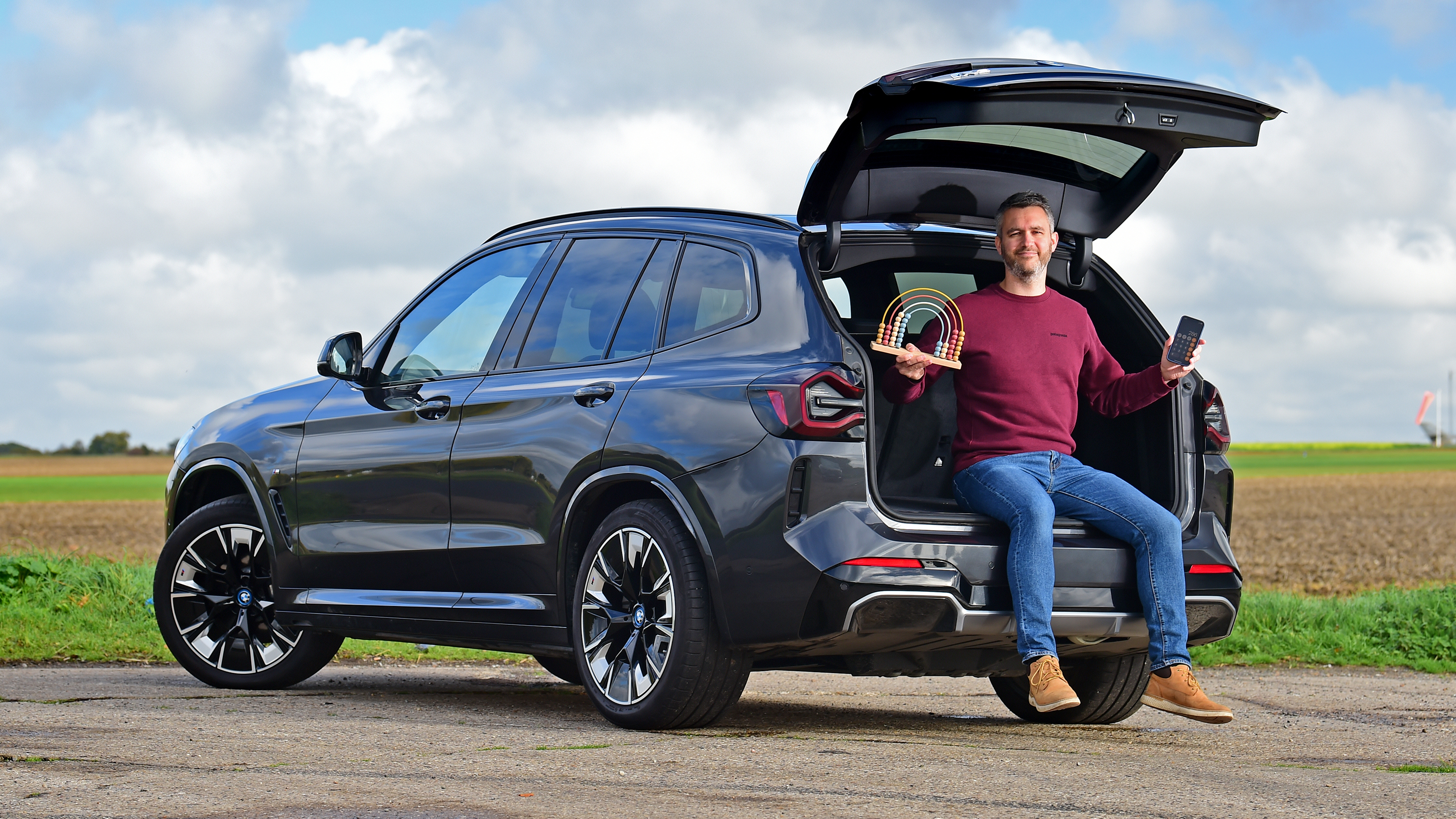 BMW iX3 - Rich Ingram sitting on tailgate