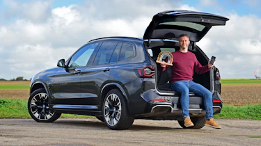 BMW iX3 - Rich Ingram sitting on tailgate