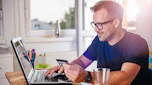Person browsing on laptop