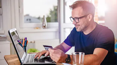 Person browsing on laptop