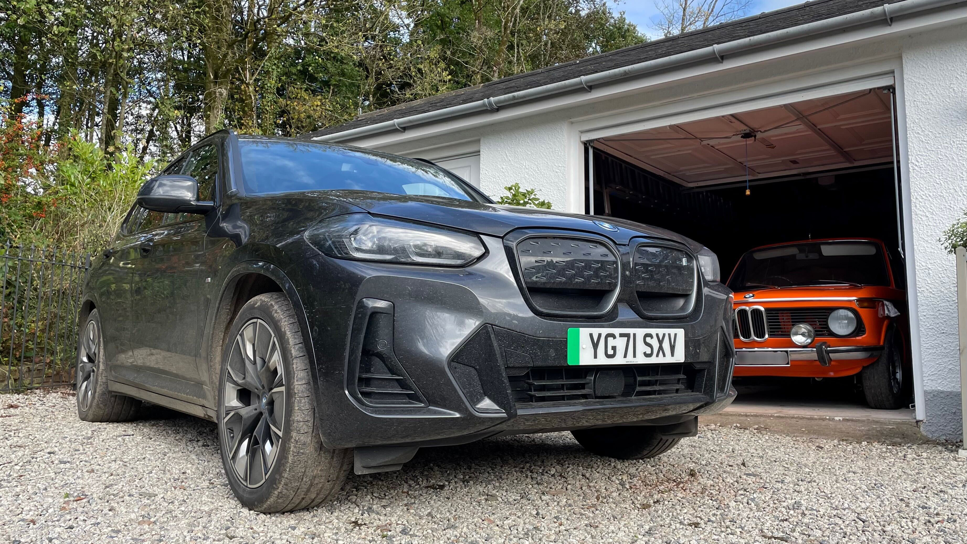 BMW iX3 - parked next to BMW 2002