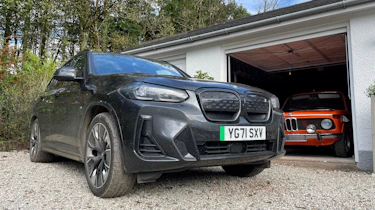 BMW iX3 - parked next to BMW 2002
