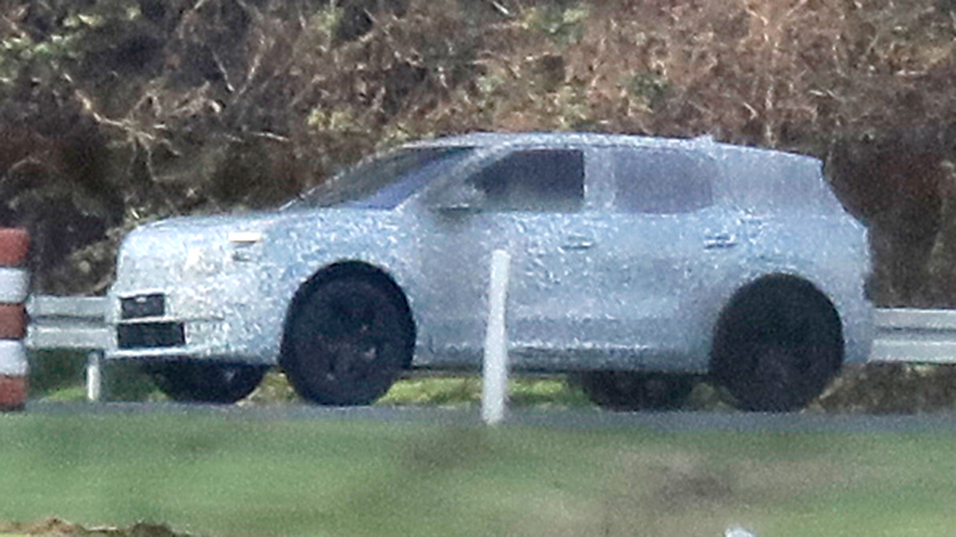 Ford EV SUV (camouflaged) spyshot - side