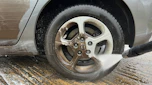Alloy wheel being cleaned with pressure washer