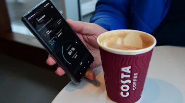 Cupra Born long-termer - viewing phone app while drinking coffee
