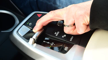 Auto Express special contributor Steve Sutcliffe operating the BMW X1's gear selector
