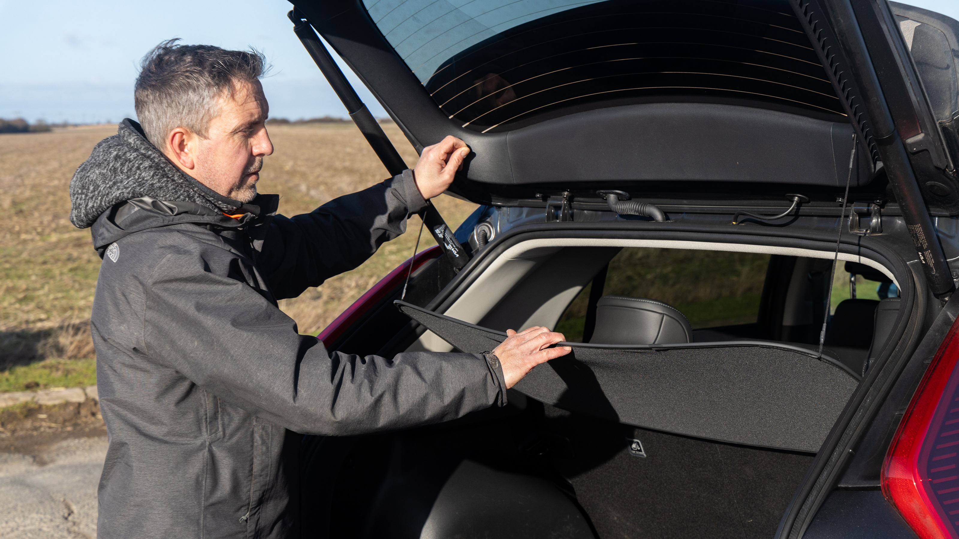 Pete Gibson loading Kia Niro boot