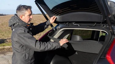 Pete Gibson loading Kia Niro boot