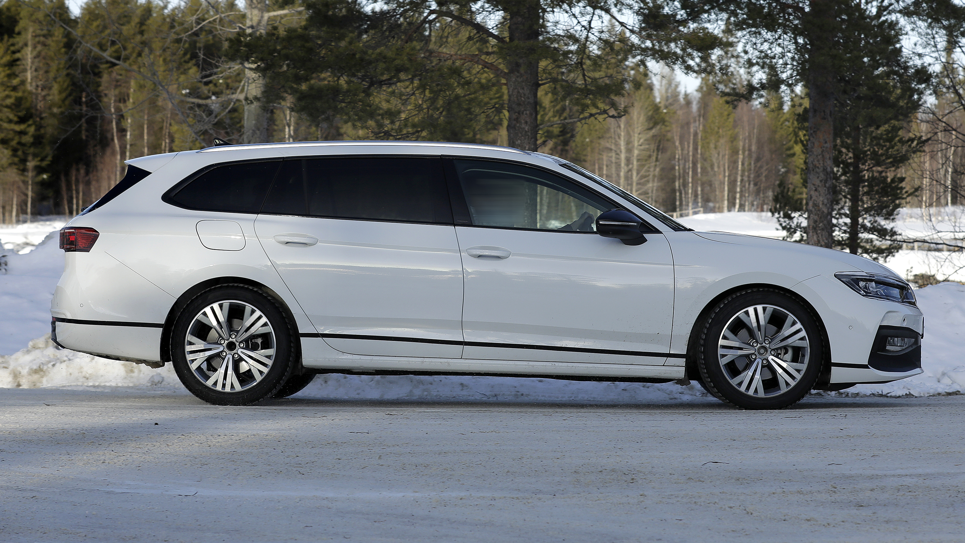 Volkswagen Passat estate (white with camouflage) - side