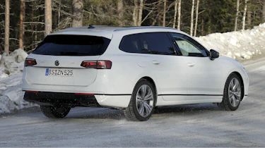 Volkswagen Passat estate (white with camouflage) - rear cornering