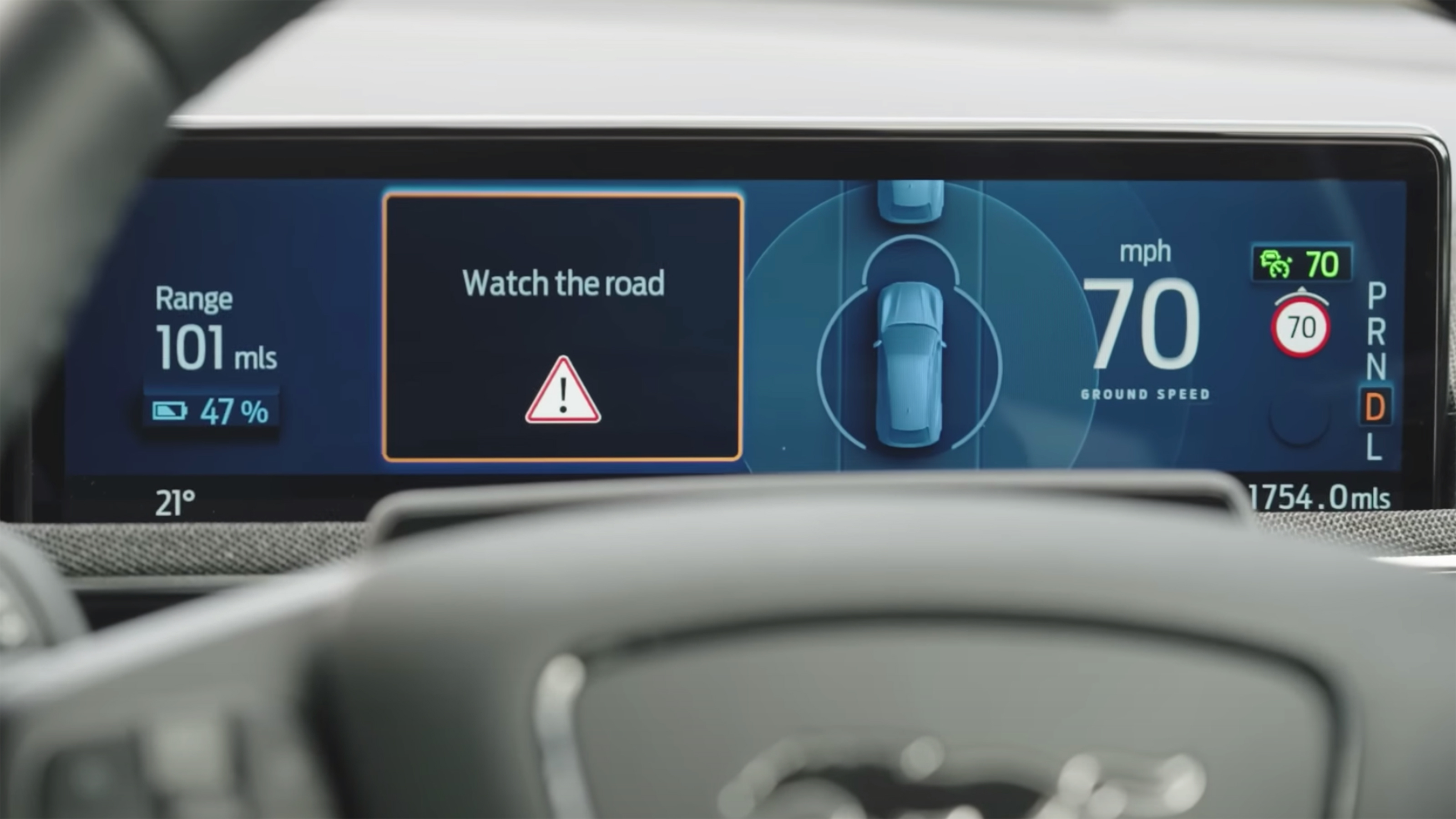 Ford Mustang Mach-e dashboard screen displaying "Watch the road" message