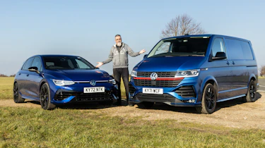Dean Gibson standing between Volkswagen Golf and Volkswagen Transporter