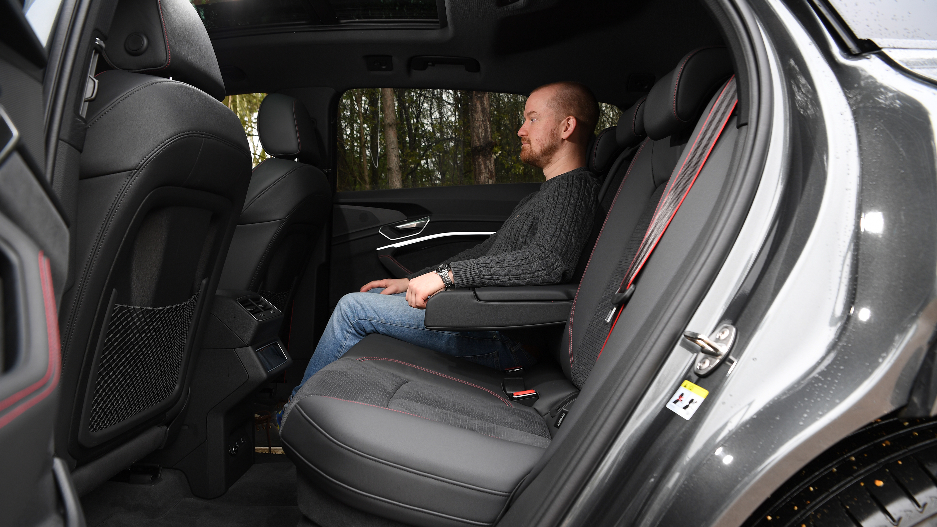 Auto Express chief reviewer Alex Ingram sitting in back seat of Audi Q8 e-tron