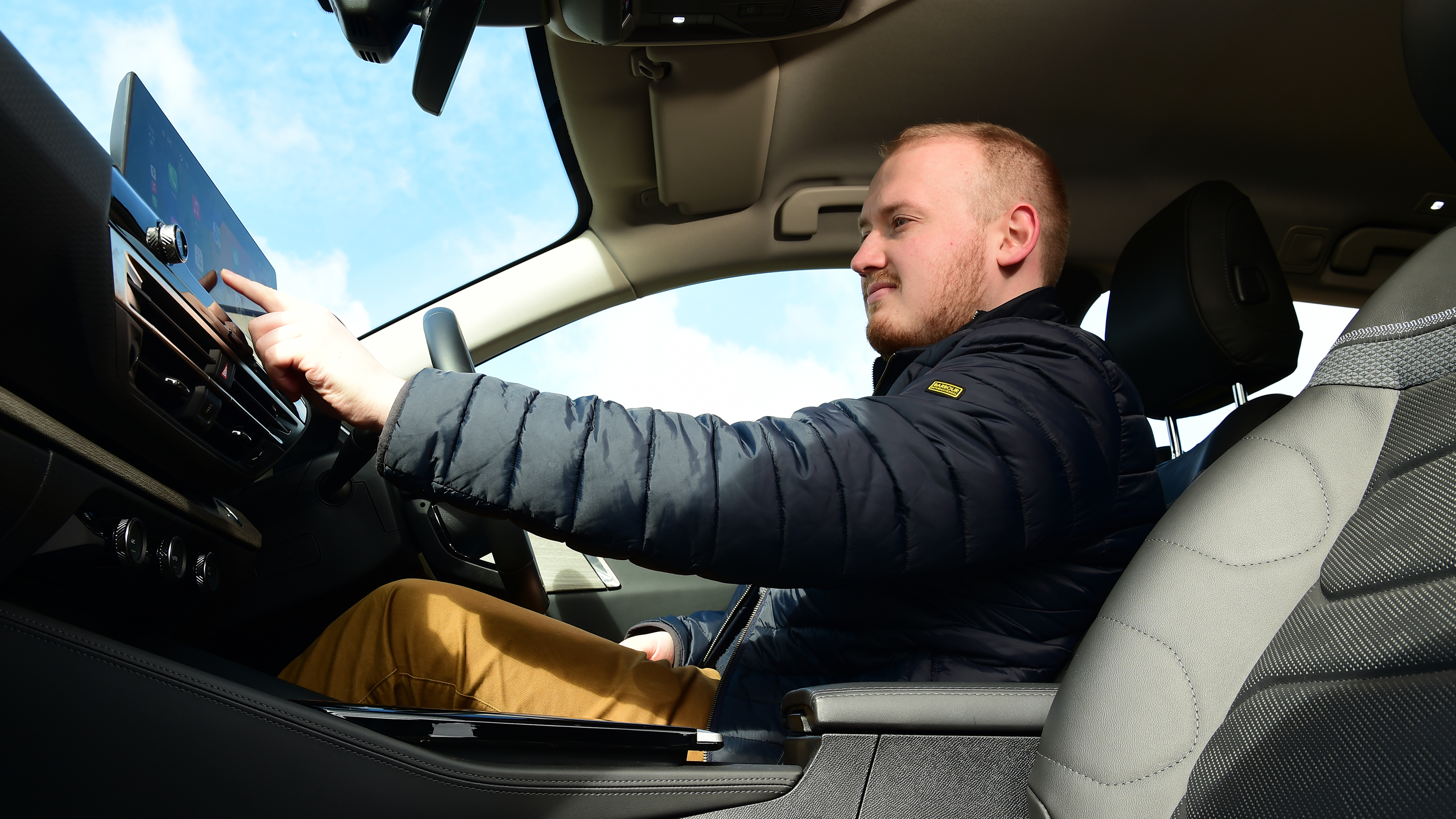 Auto Express Reviews Editor Ellis Hyde operating Citroen C5 x infotainment touchscreen