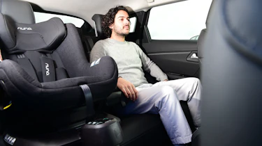 Auto Express Senior Staff Writer Jordan Katsianis sitting in Citroen C5 X back seat