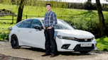 Tristan Shale-Hester standing next to the Honda Civic Sport