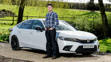 Tristan Shale-Hester standing next to the Honda Civic Sport
