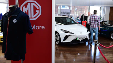MG-branded jacket hanging on MG sign