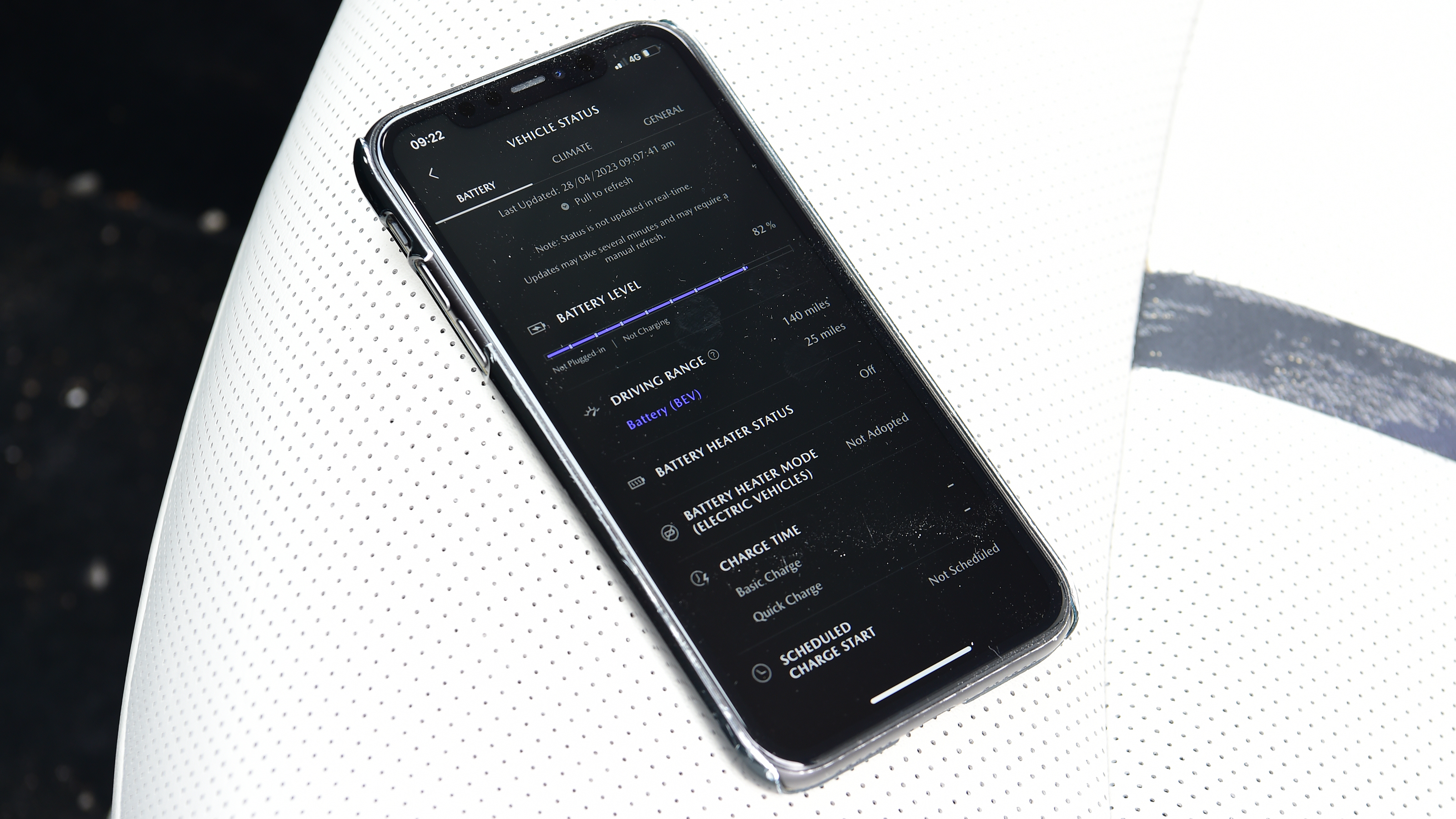 Mobile phone displaying Mazda app