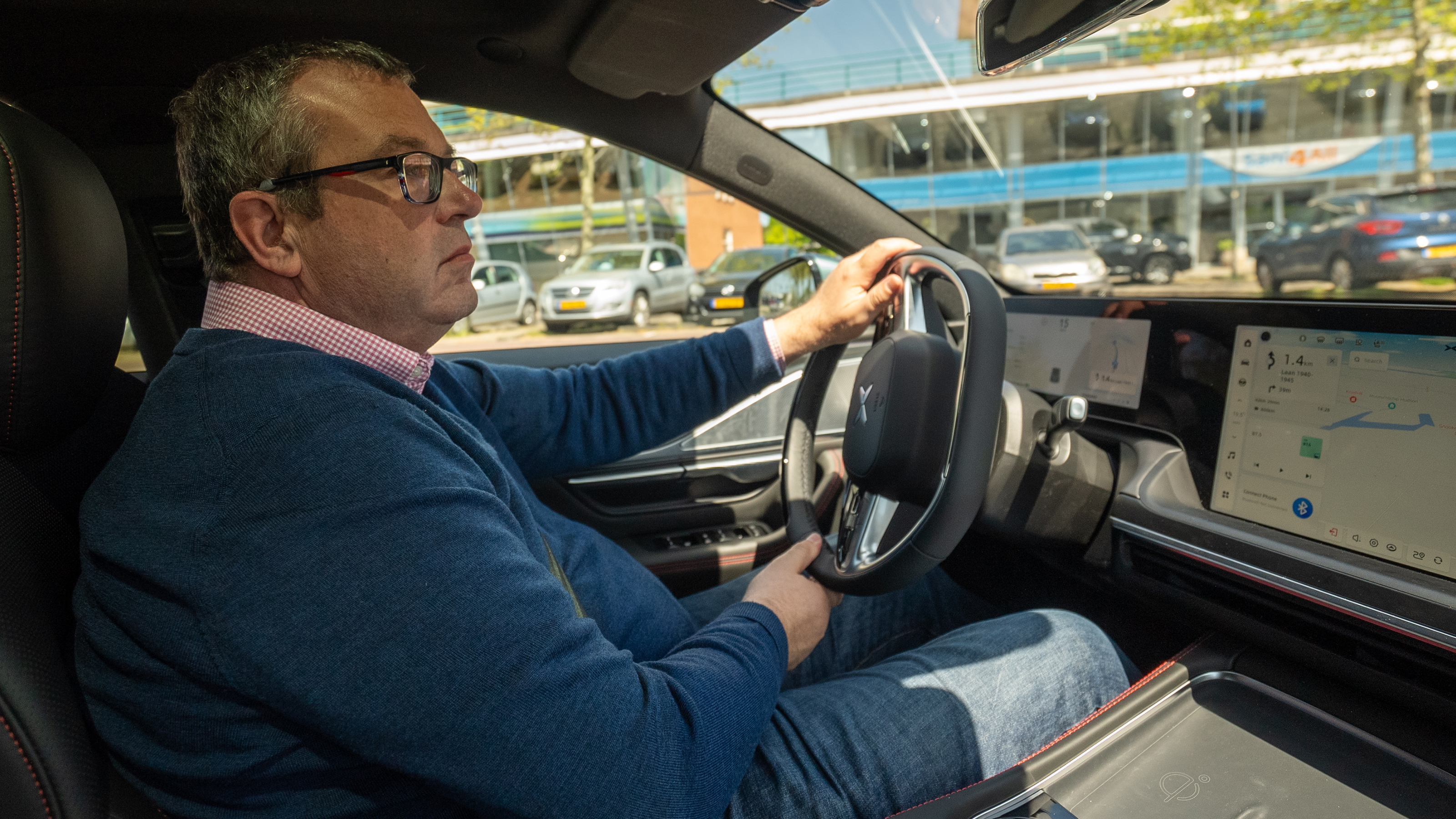 Auto Express deputy editor John McIlroy driving XPeng P7 (Passenger-side view)