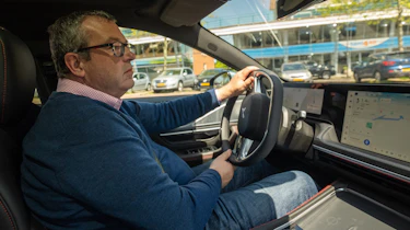 Auto Express deputy editor John McIlroy driving XPeng P7 (Passenger-side view)