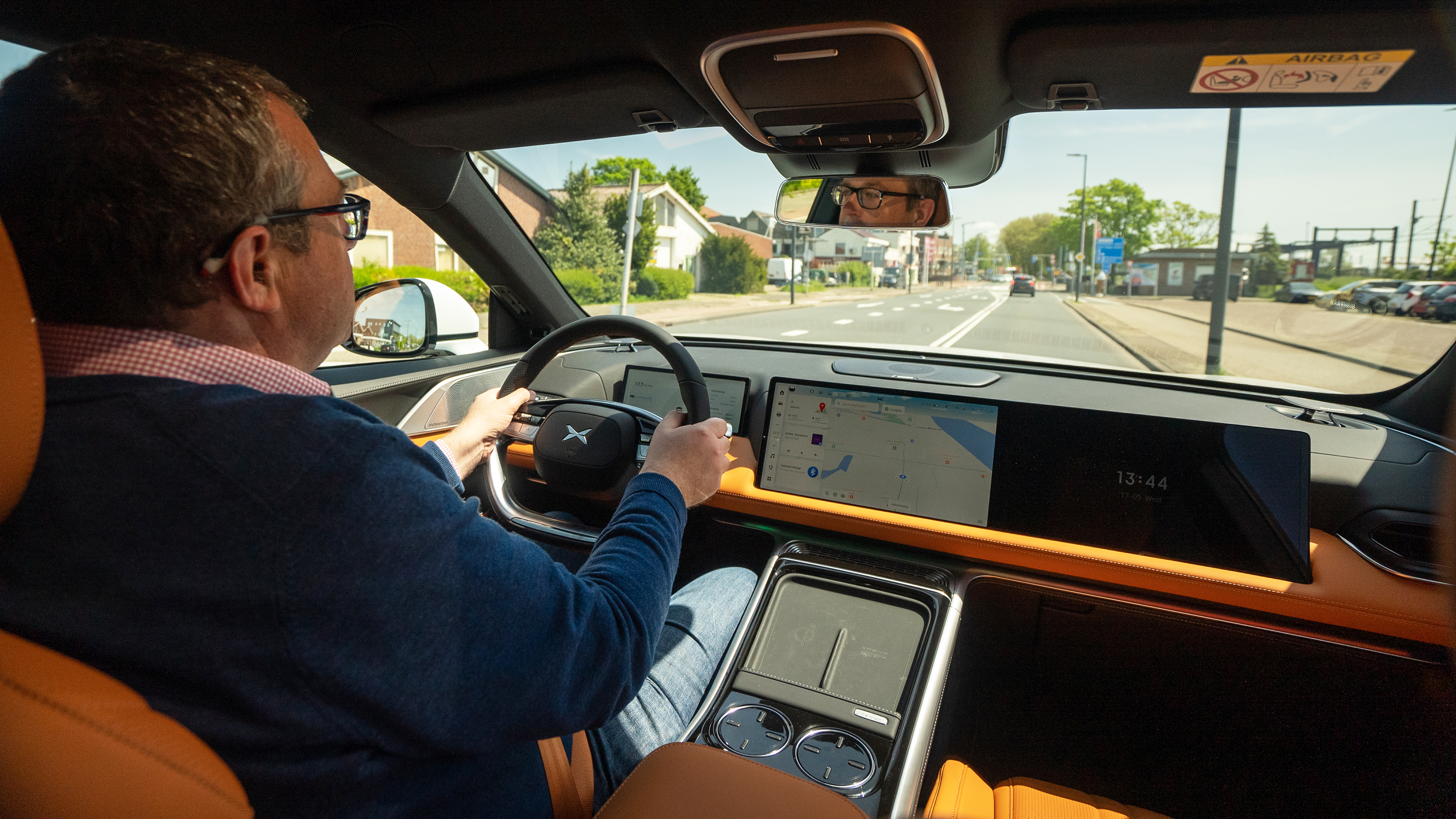 Auto Express deputy editor John McIlroy driving Xpeng G9 (over-shoulder view)