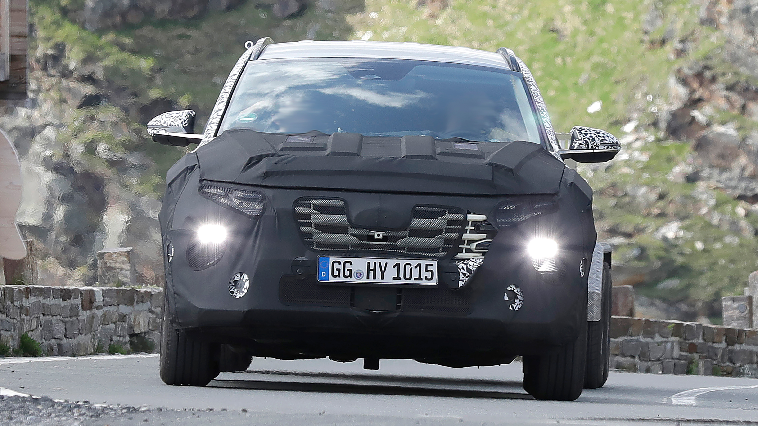 2024 Hyundai tucson (camouflaged) - front (headlights on)