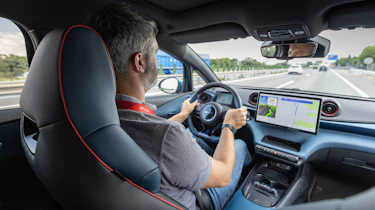 DrivingElectric and Carbuyer editor Richard Ingram driving the BYD Dolphin