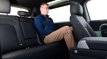 Sean Carson sitting in the Land Rover Defender 75th Limited Edition