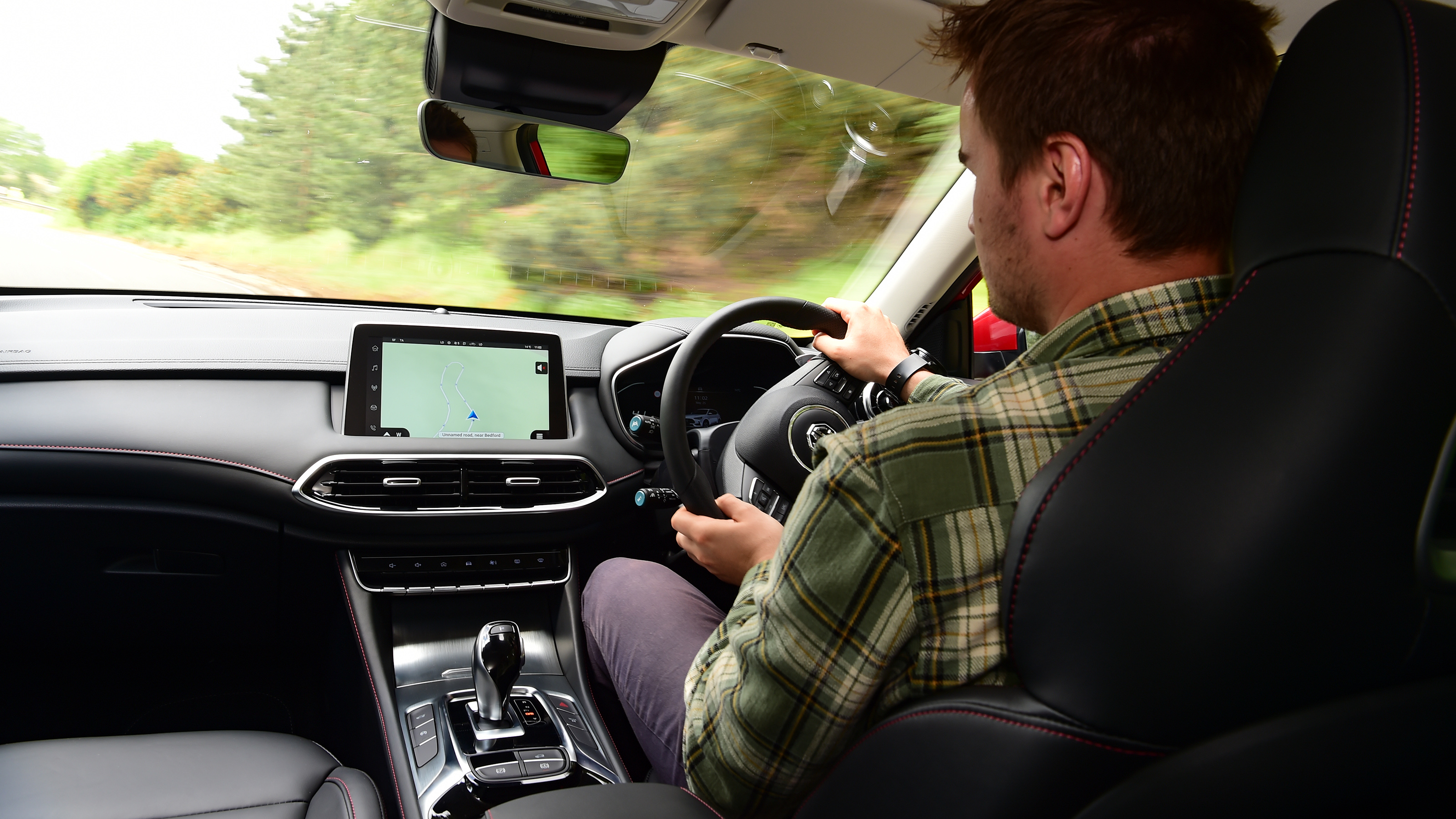 Auto Express staff writer Alastair Crooks driving the facelifted MG HS