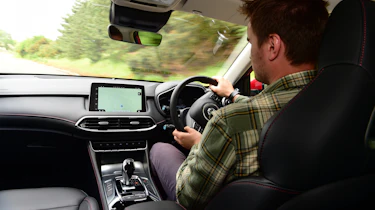 Auto Express staff writer Alastair Crooks driving the facelifted MG HS