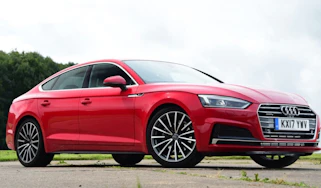 Red Audi A5 Sportback - front side tracking.