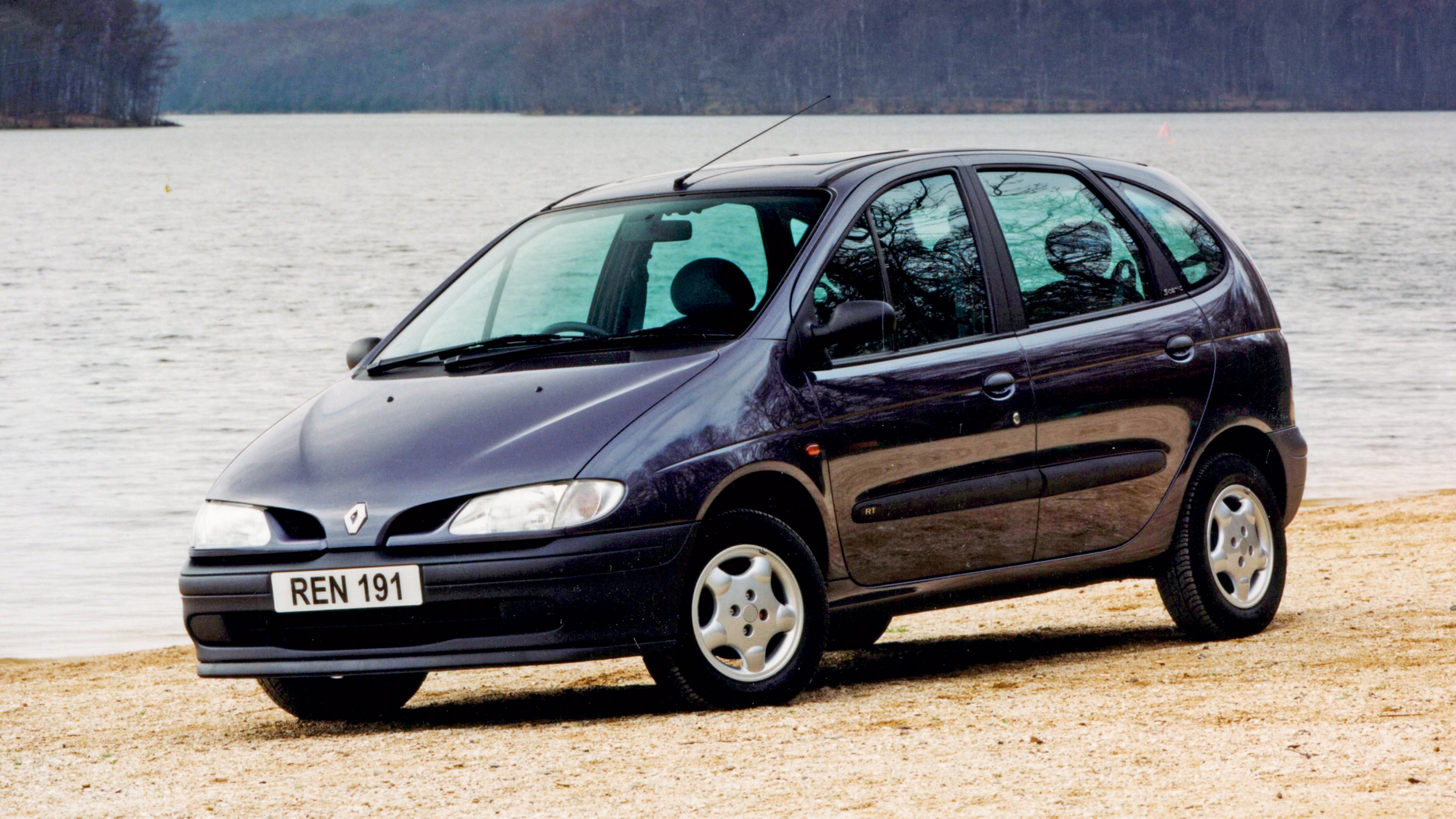 A side view of a black Renault.