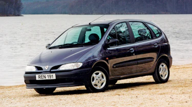 A side view of a black Renault.