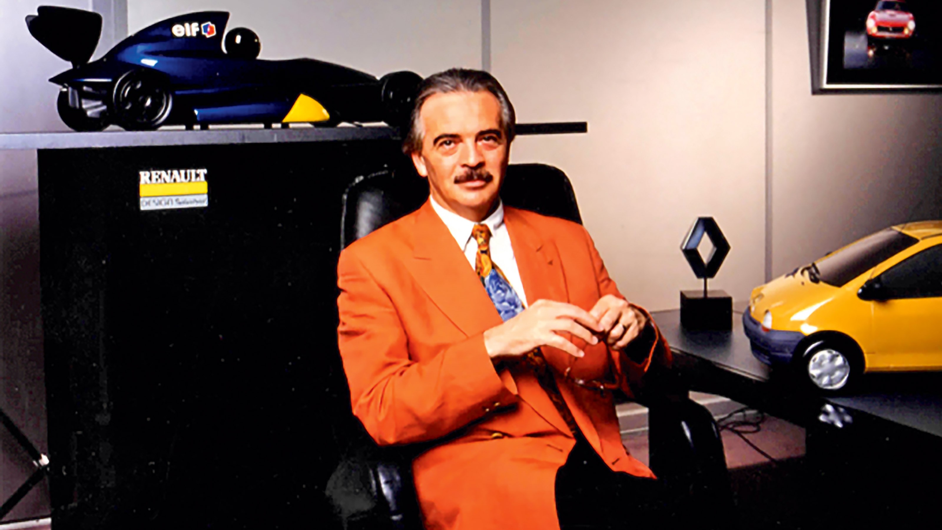 Patrick le QuEment sitting down in an office - front shot.