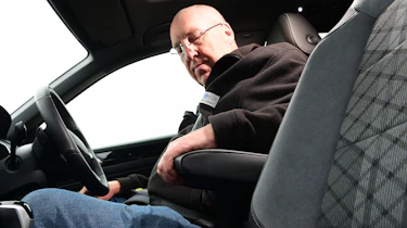 Auto Express products editor Kim Adams adjusting the Volkswagen T-Roc's armrest