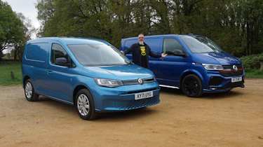 Auto Express senior test editor Dean Gibson standing between the Volkswagen Transporter and Volkswagen Caddy