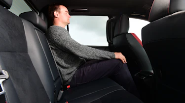 Auto Express senior test editor Dean Gibson sitting in the back of the Toyota Hilux