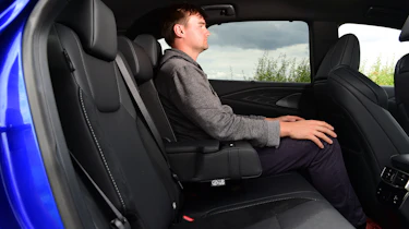 Auto Express staff writer Alastair Crooks sitting in the back seat of the Lexus RX 500h
