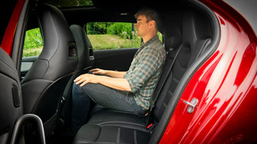 Auto Express staff writer Alastair Crooks sitting in the back seat of the Mercedes-AMG A35
