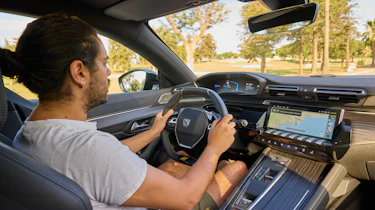 Auto Express senior staff writer Jordan Katsianis driving the Peugeot 508 PSE