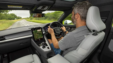 Carbuyer and DrivingElectric editor Richard Ingram driving the updated Polestar 2 in the UK